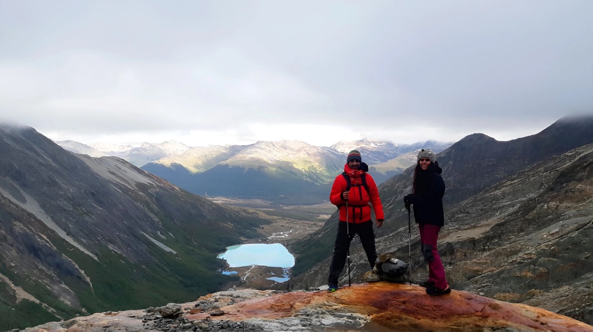 Trekking group on the natural terrace overlooking the lagoon and the glacier, Ojo del Albino, Ushuaia