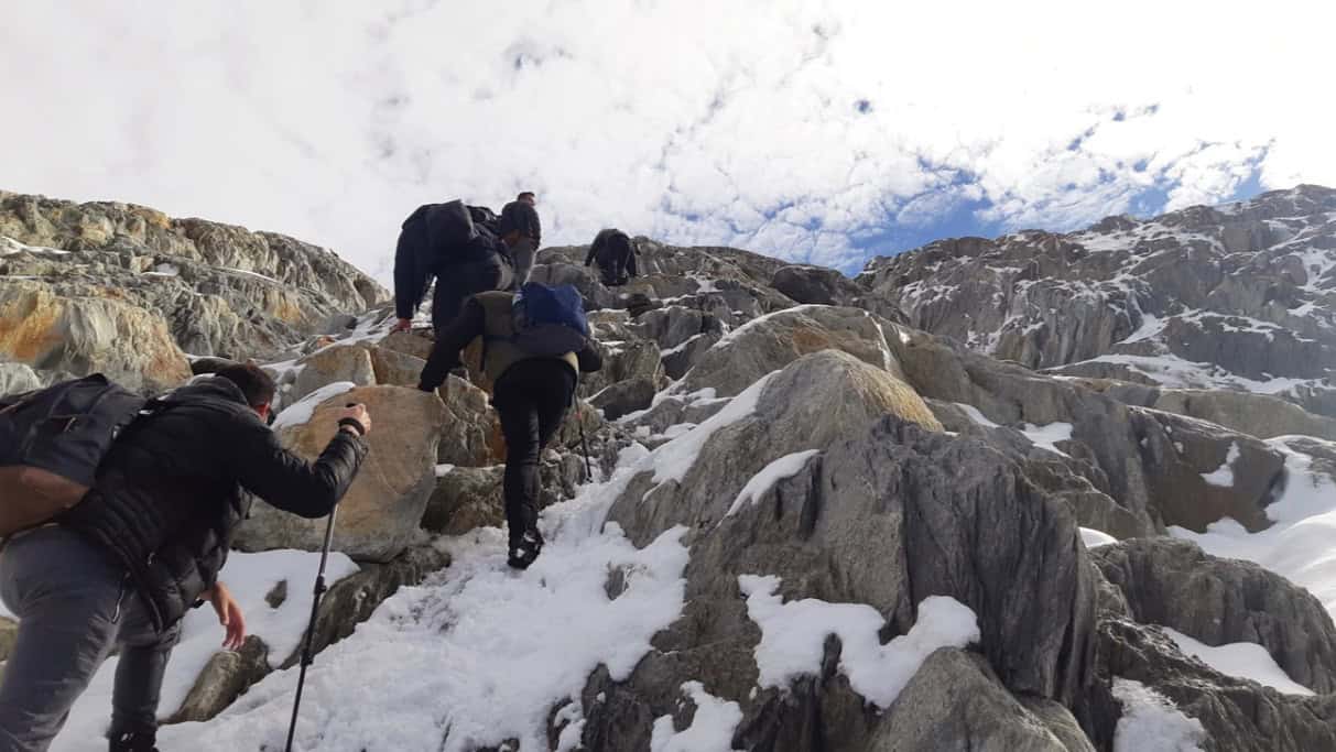 Crossing between large rock blocks on the ascent to the Ojo del Albino Glacier, Ushuaia