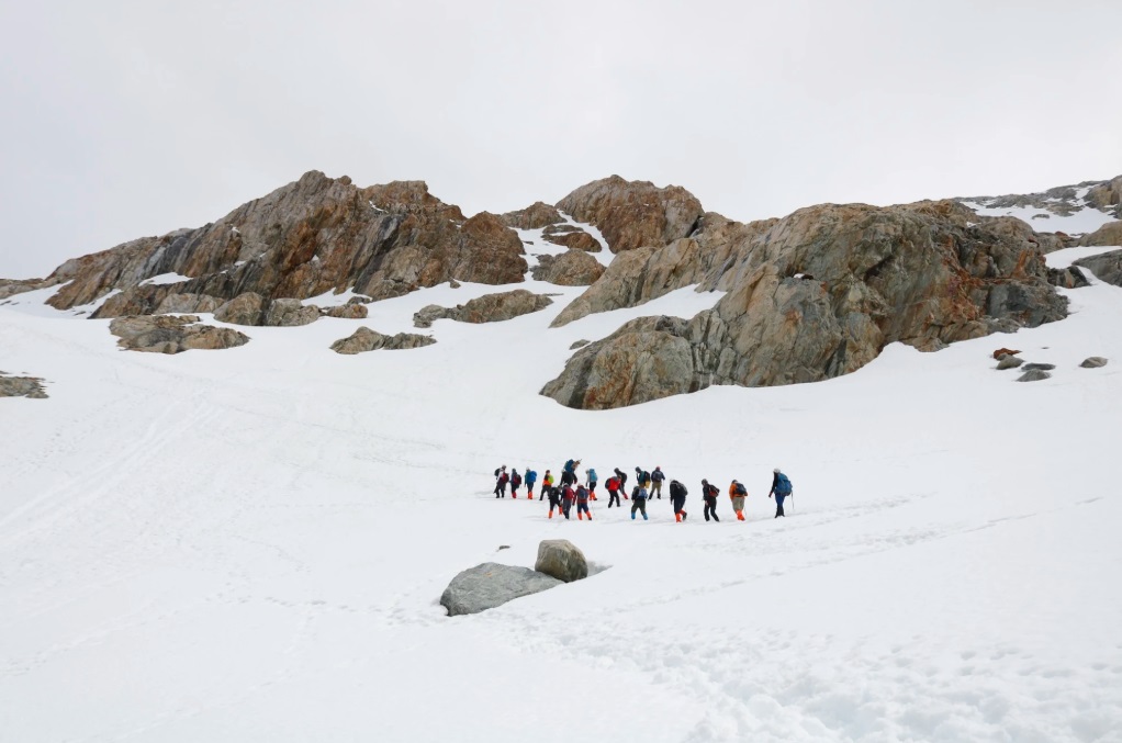 Group crossing the snow towards the Ojo del Albino Glacier, Ushuaia
