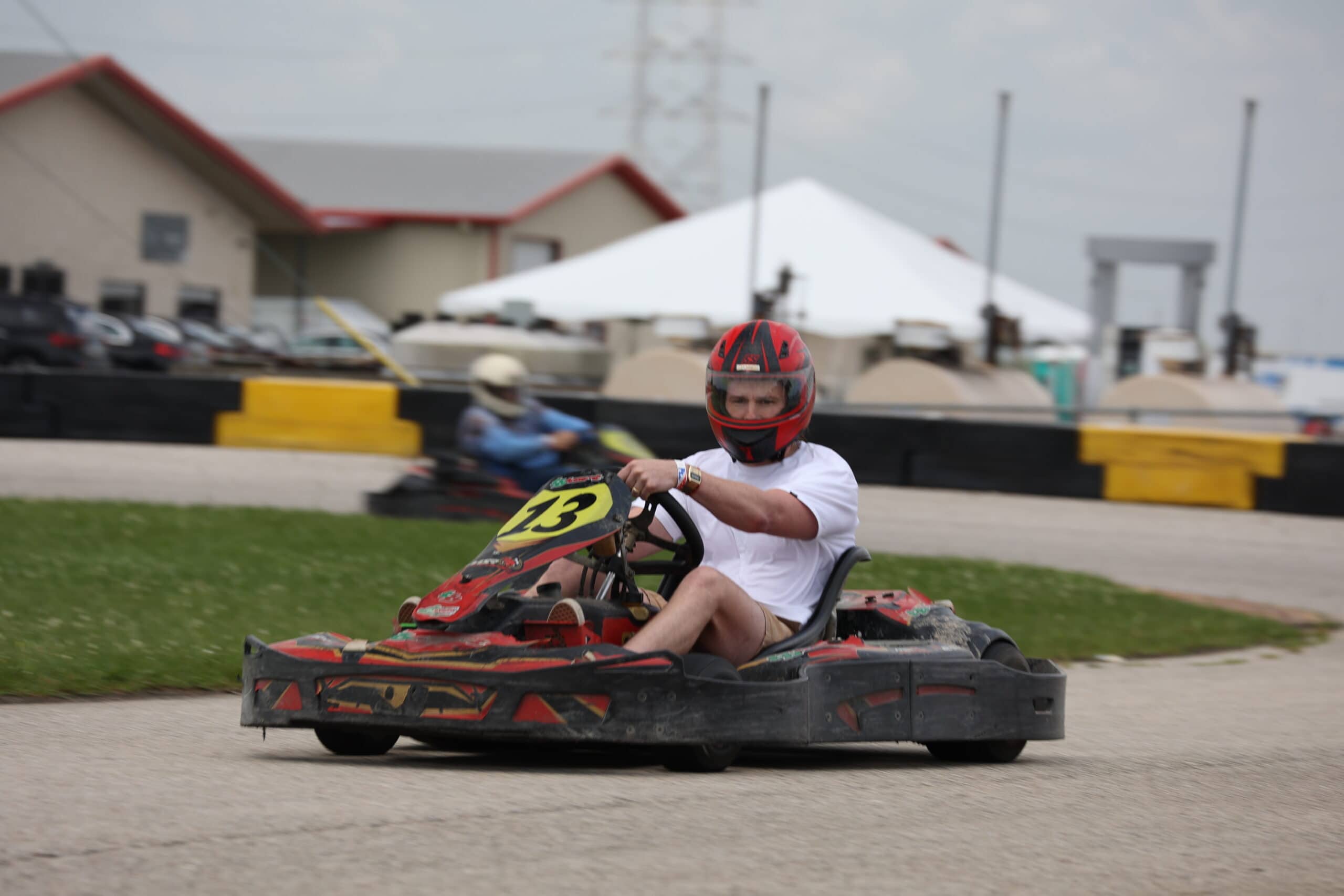 Young racer in go-kart at Mustang Week event in Texas 2025.
