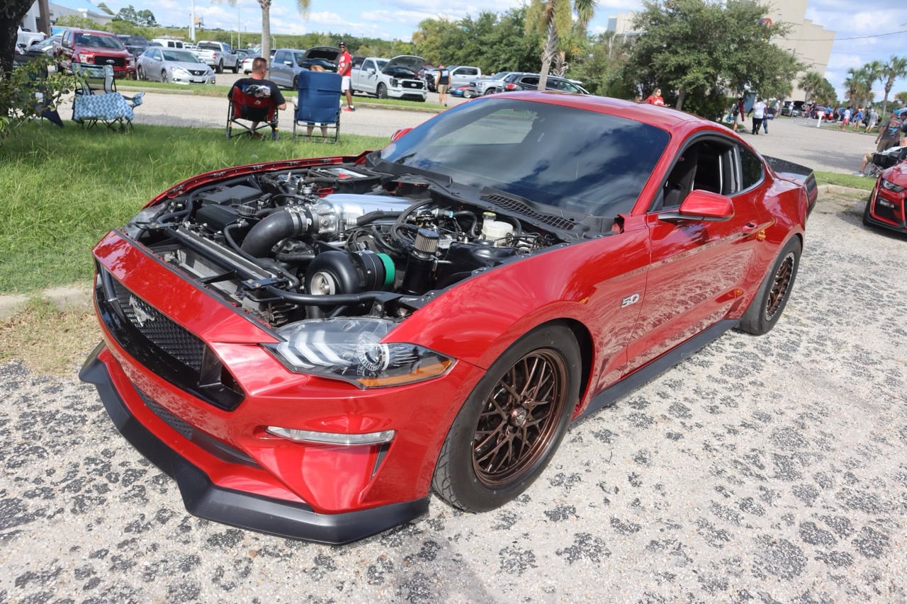 Red Ford Mustang with open hood at Myrtle Beach 2025.