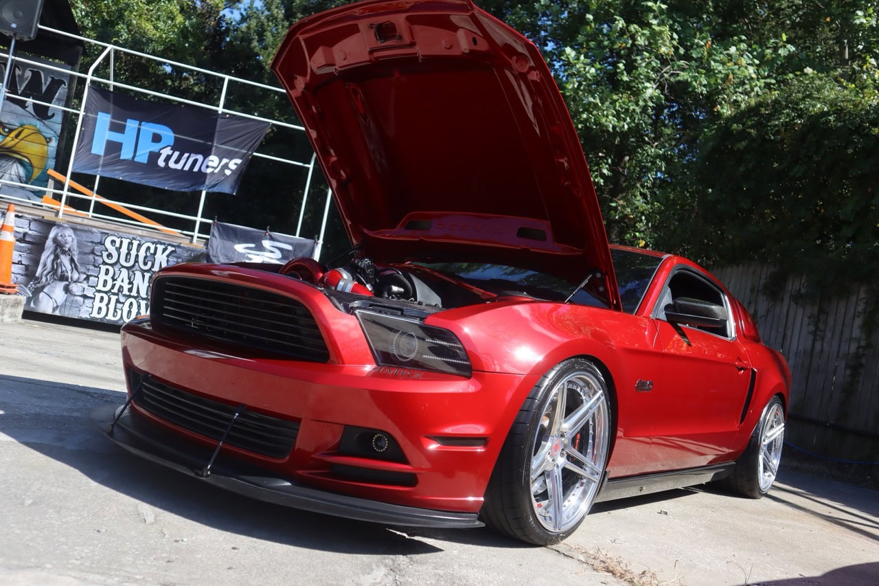 Red Ford Mustang with open hood at Myrtle Beach event.