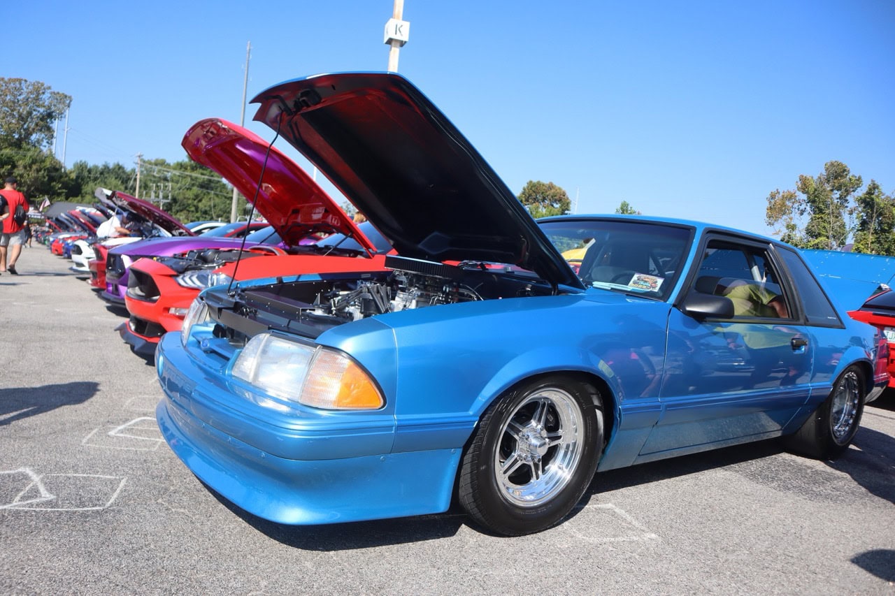 Classic blue Ford Mustang at Mustang Week event.