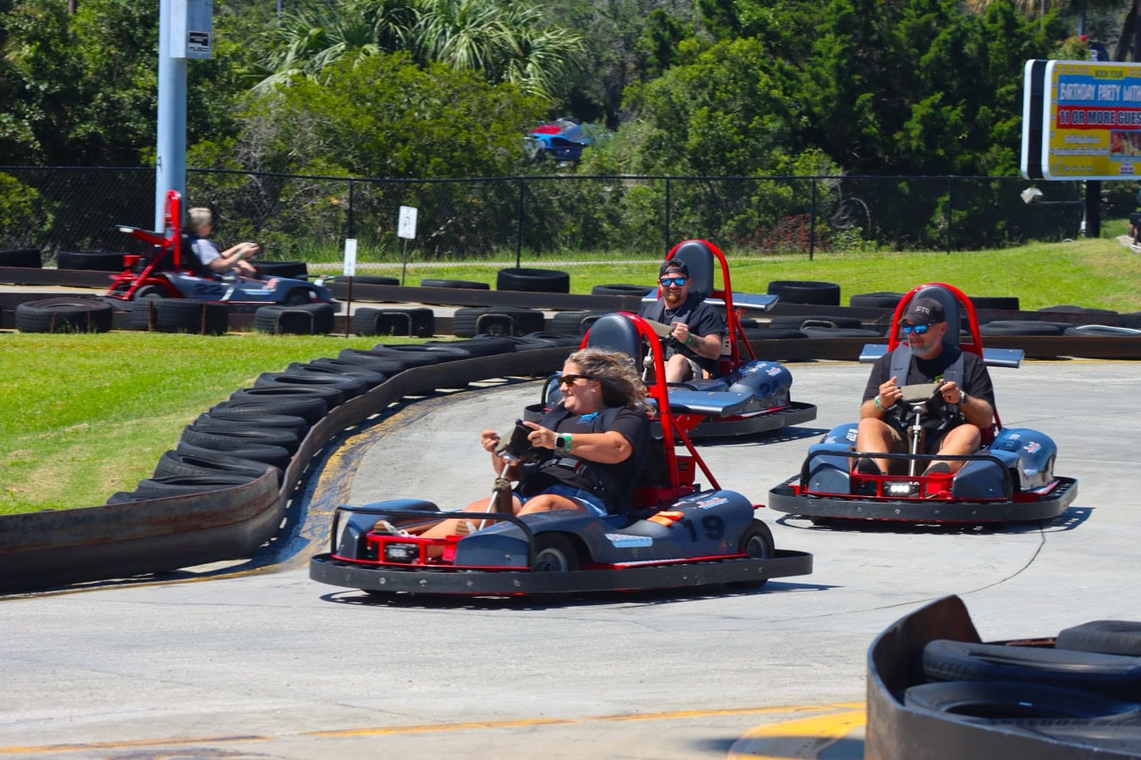 People racing go-karts at Mustang Week event in Myrtle Beach 2025.