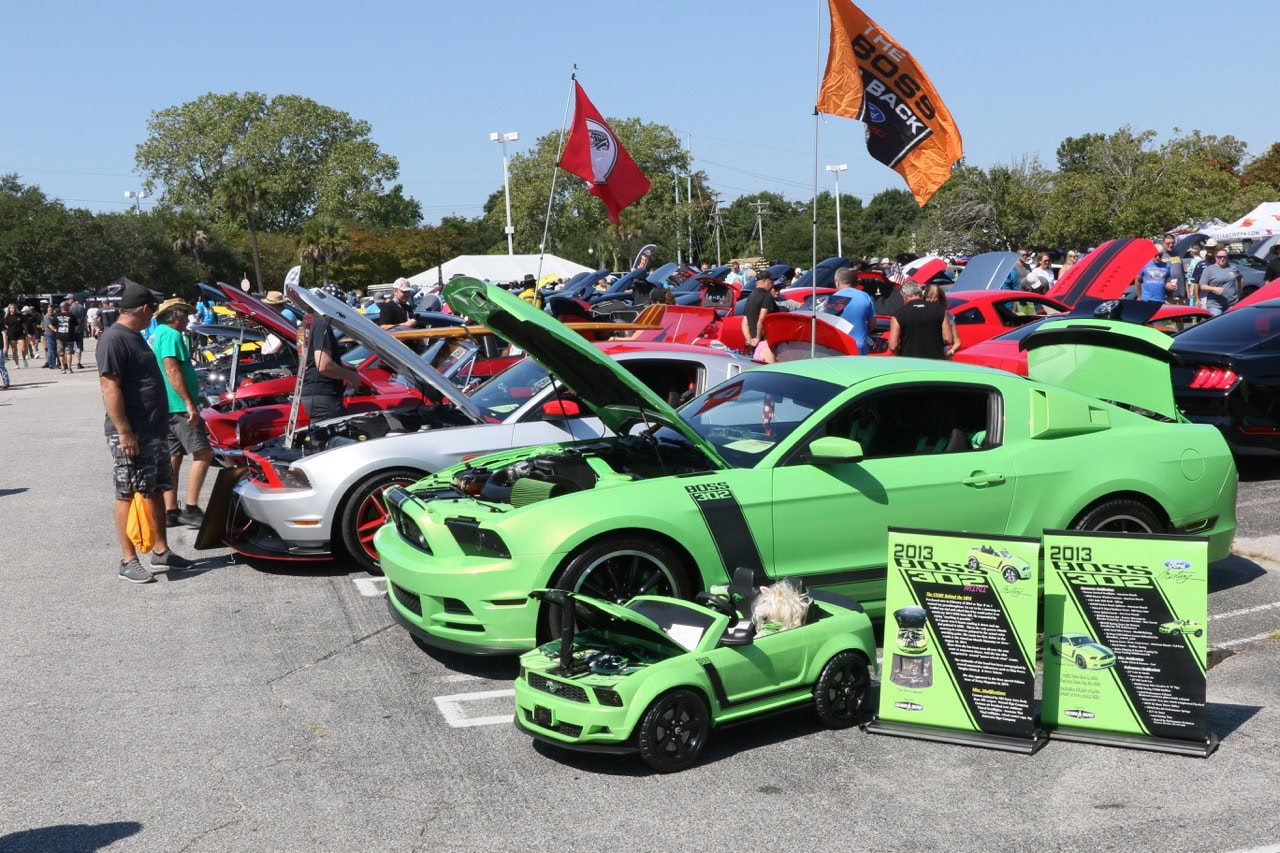 Vibrant green 2013 Ford Mustang at Myrtle Beach car event 2025.