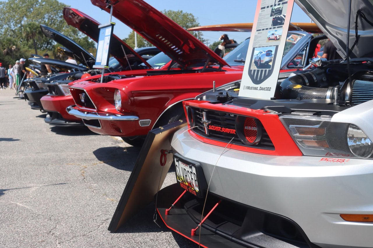 Lineup of classic and modern Ford Mustangs at Mustang Week 2025.