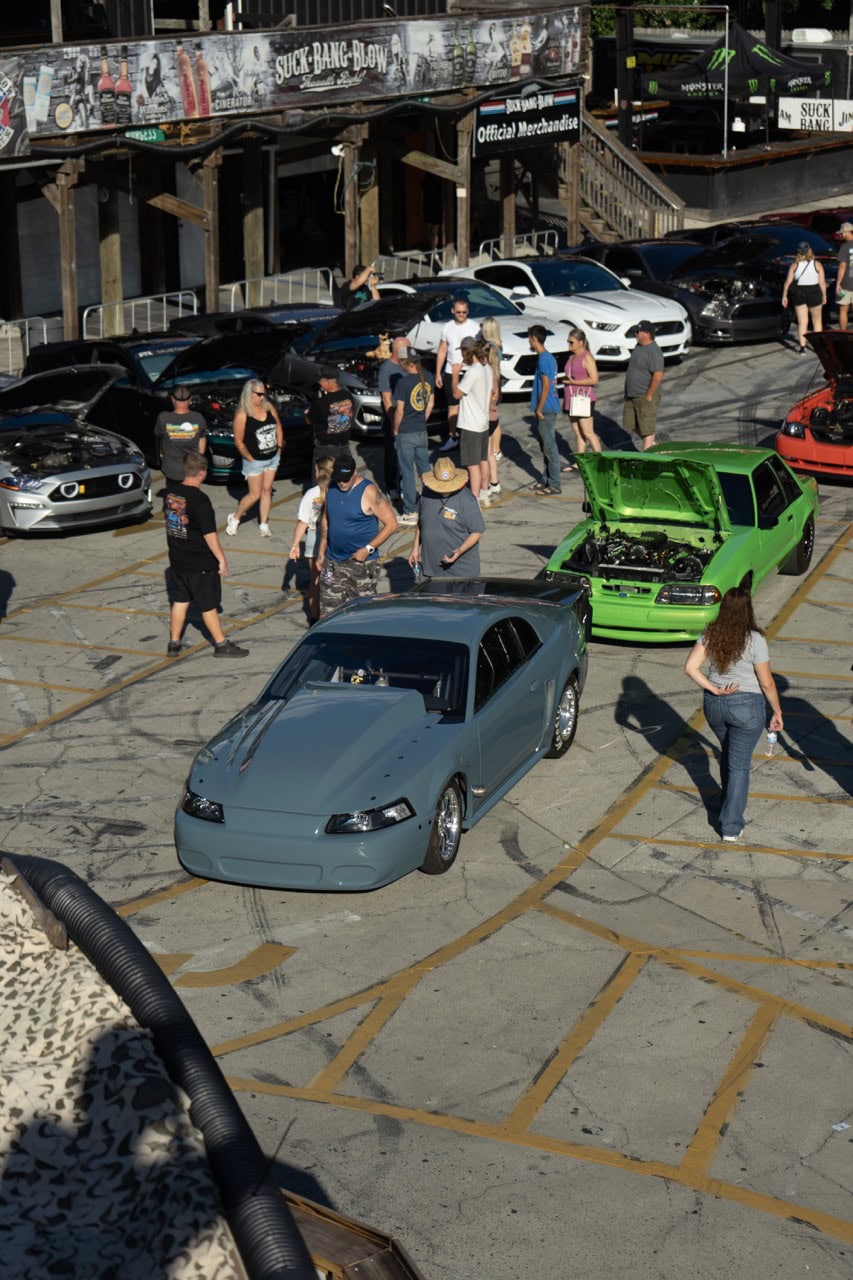 Car enthusiasts at Mustang Week Myrtle Beach 2025 car show.
