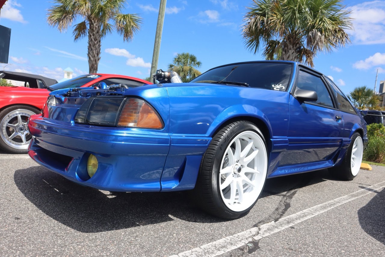 Blue Ford Mustang at Myrtle Beach car show during Mustang Week 2025.