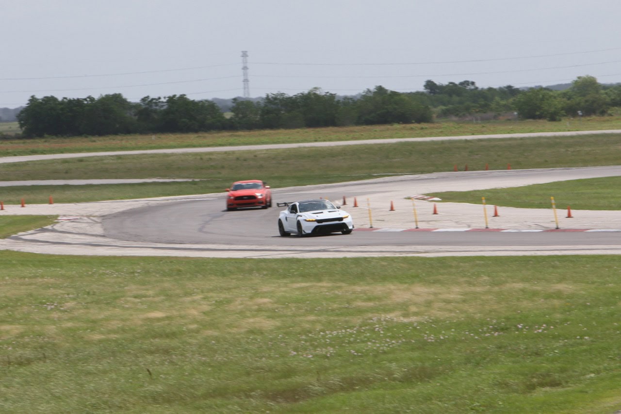 High-speed Ford Mustang track race at Mustang Week.