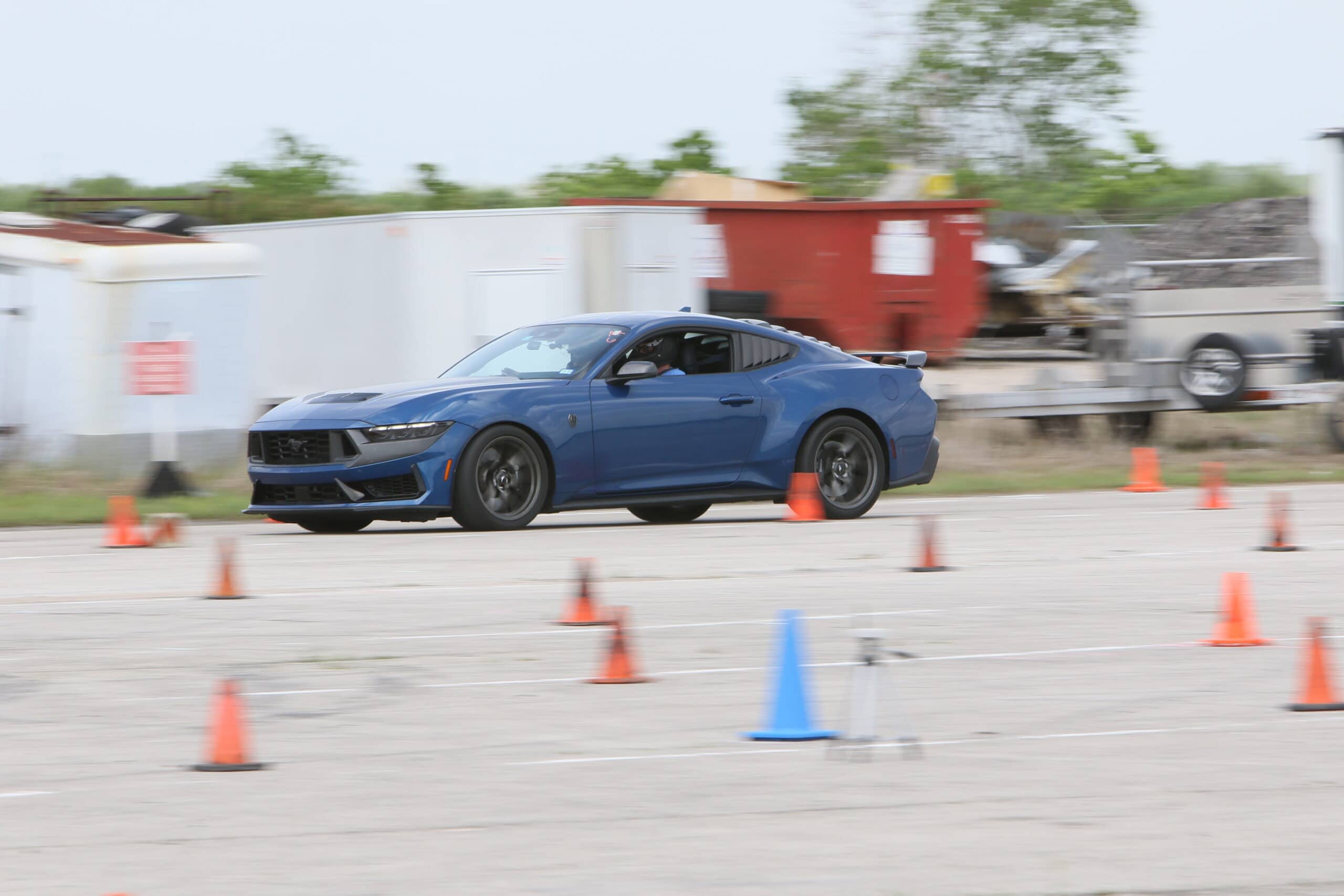 Blue Ford Mustang participating in a driving skills event at Mustang Week.