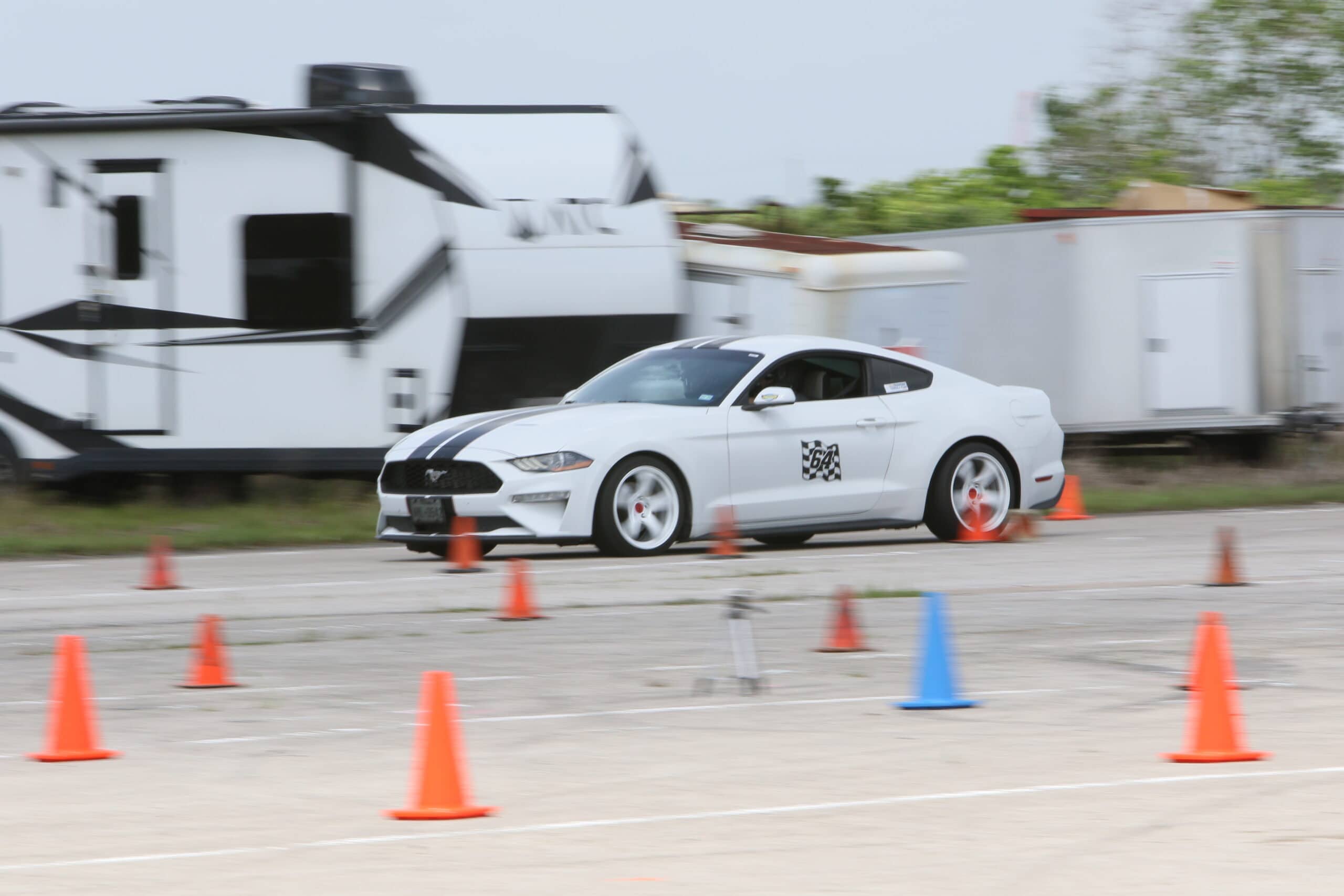 White Ford Mustang participating in Mustang Week autocross event.
