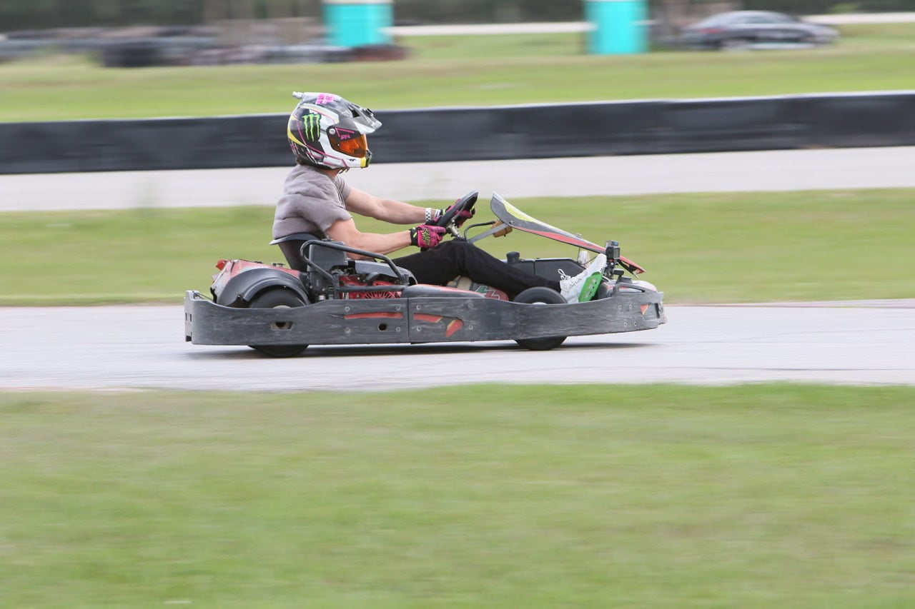 High-speed go-kart racing at Mustang Week event.