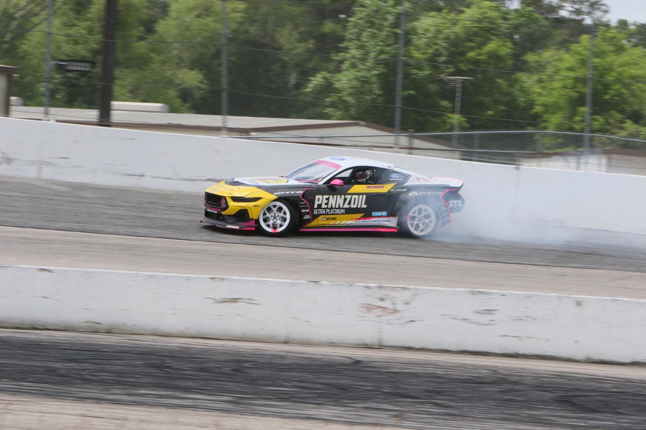 High-speed Mustang racing at Texas 2026 event.