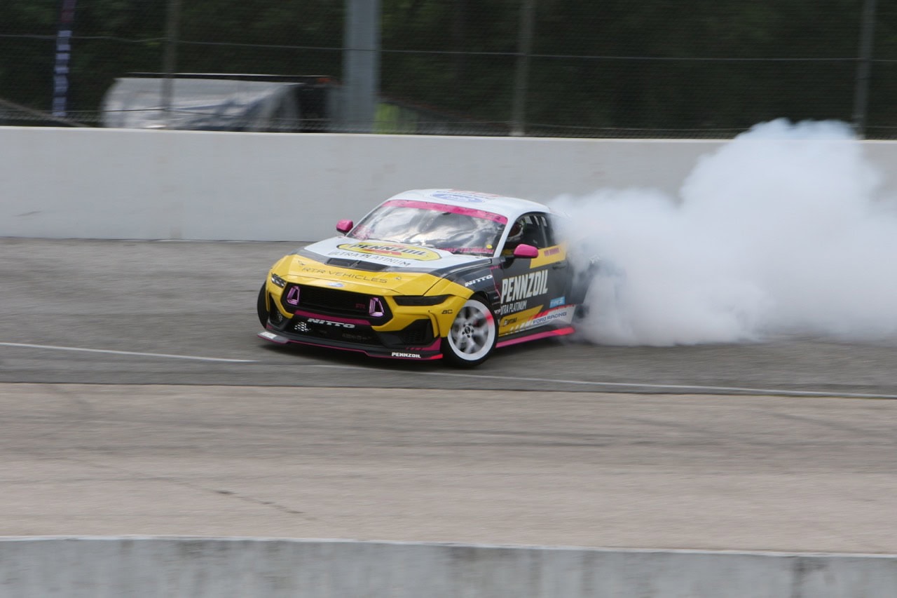 High-speed Mustang race car drifting at Mustang Week event in Texas 2026.