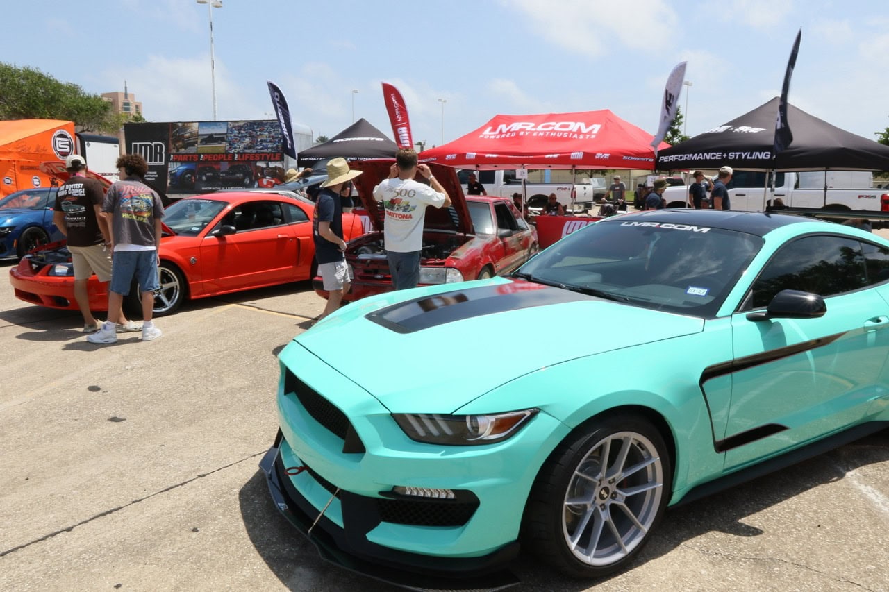 Vibrant turquoise Ford Mustang at Mustang Week car event in Texas 2026.