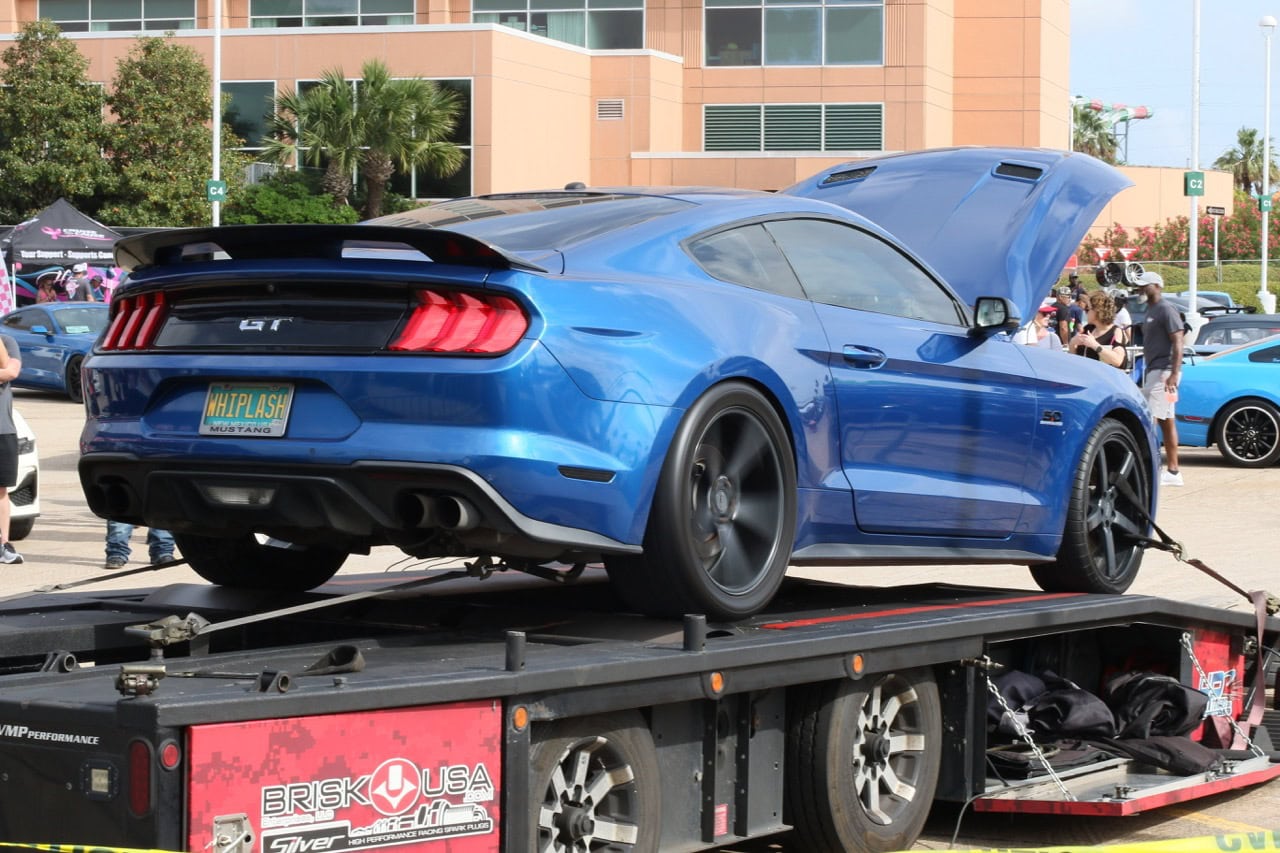 Blue Ford Mustang GT on display at Mustang Week event.