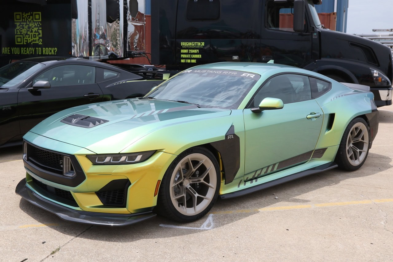Custom yellow-green Ford Mustang at Mustang Week event.