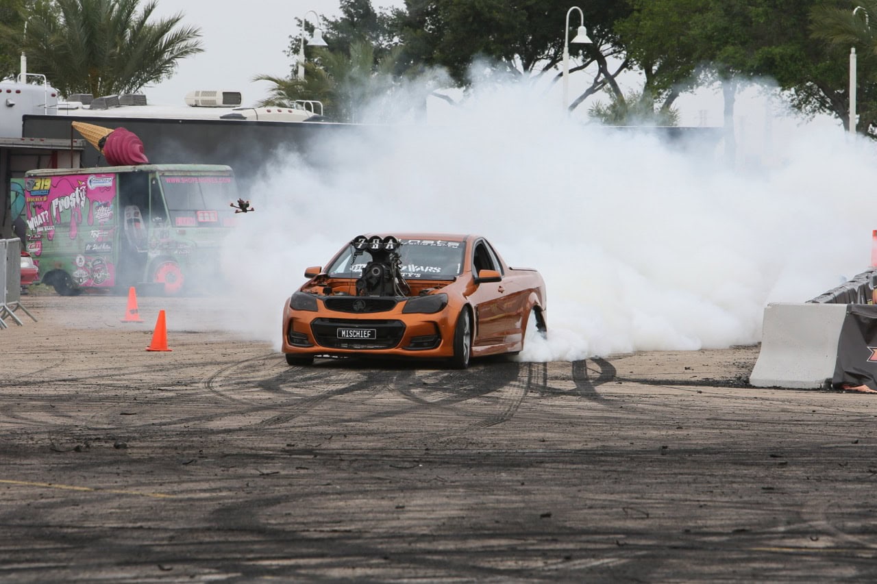 Mustang Week drift car performing burnout in Texas 2026 event.