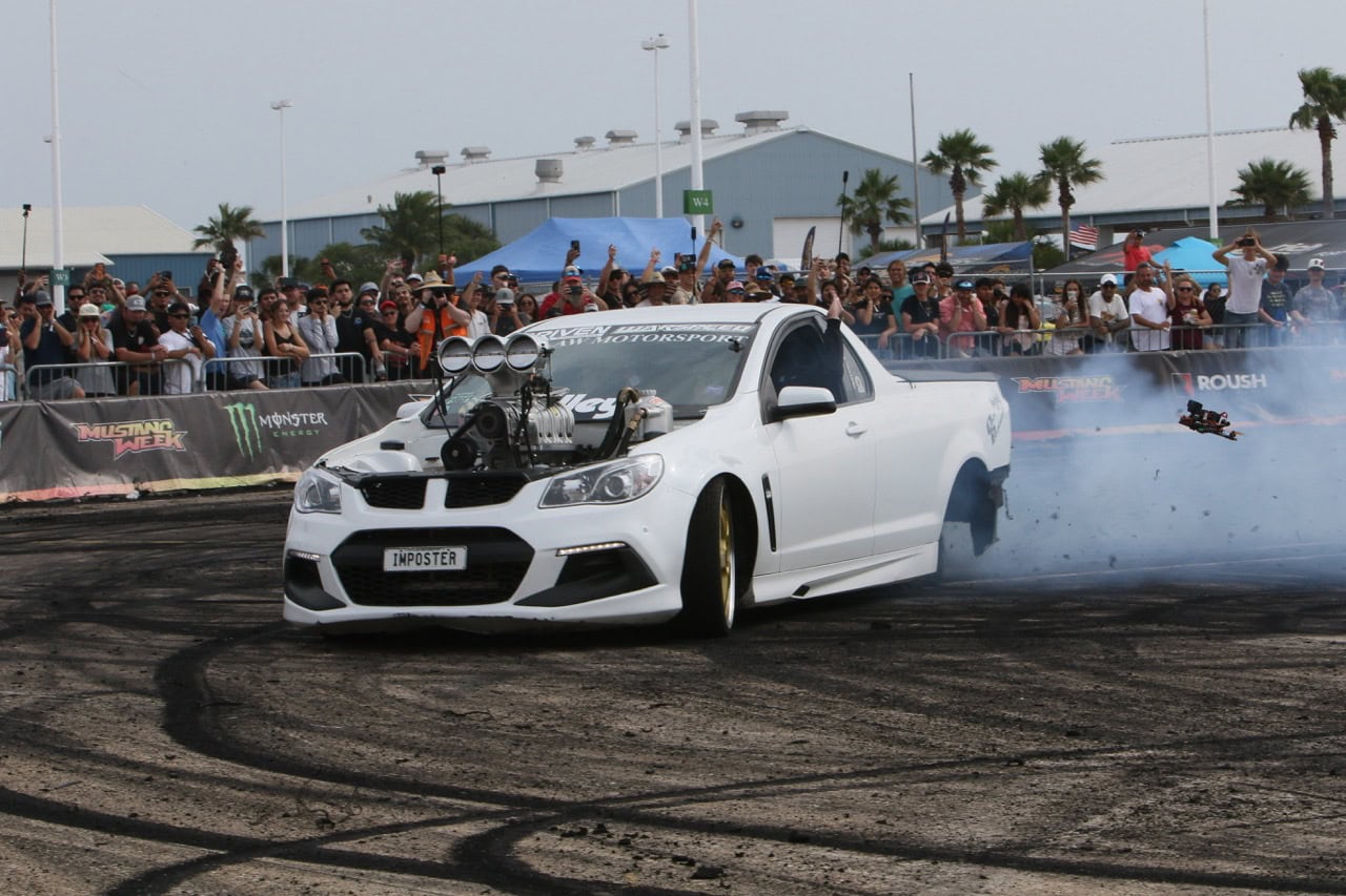 High-performance Ford Mustang drifting at Mustang Week event.