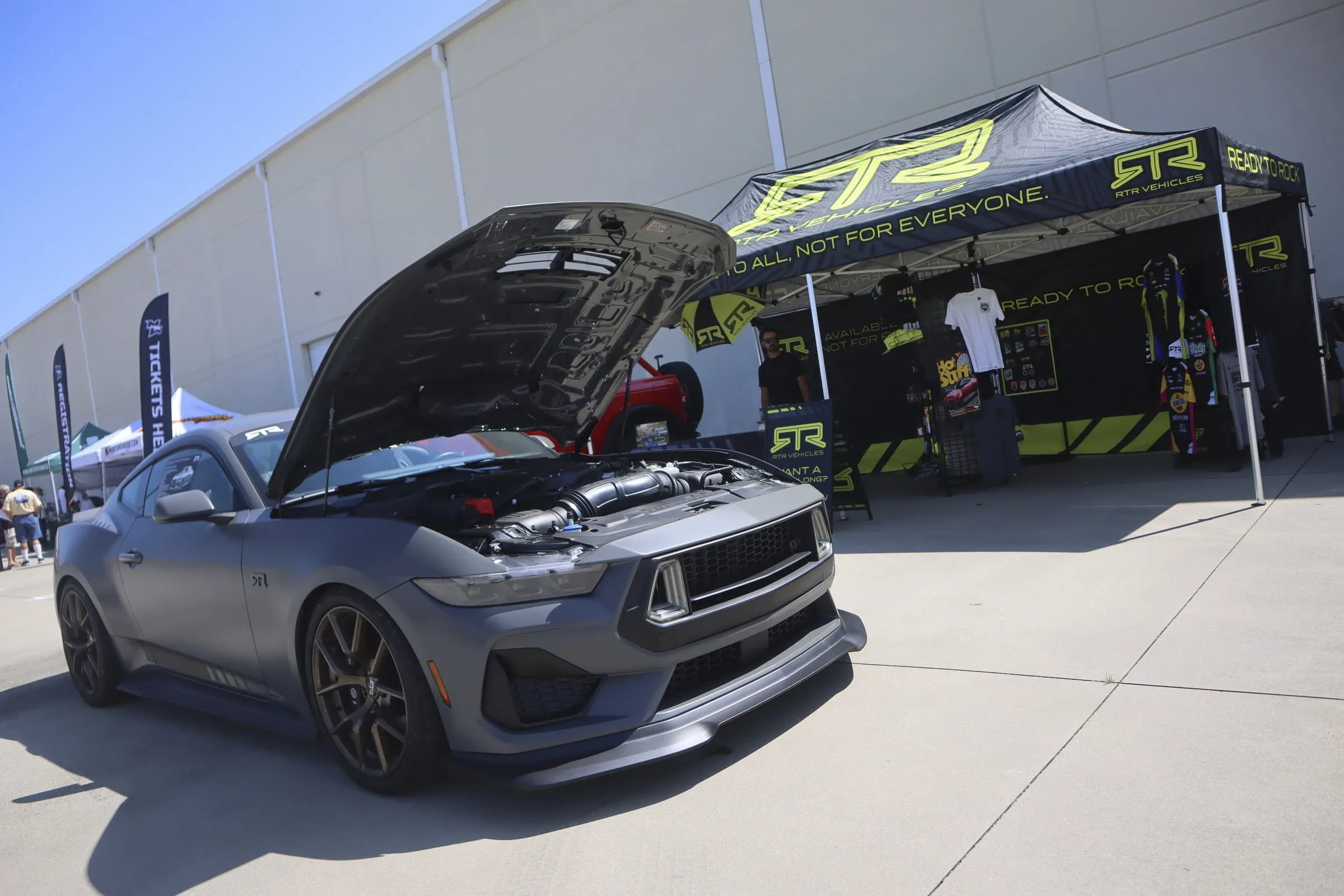 Gray Ford Mustang with open hood at Mustang Week event in Charlotte 2026.