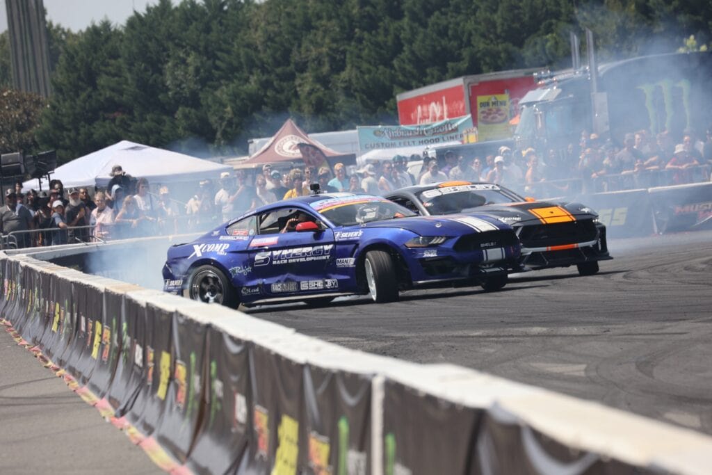 Drag racing cars at Mustang Week Charlotte 2026 event.