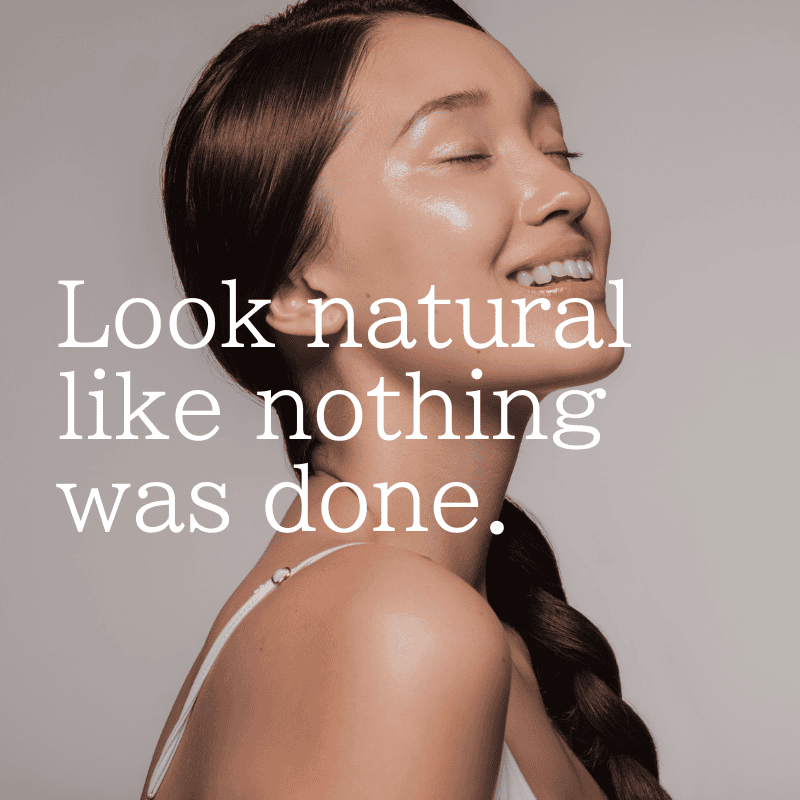 Woman tilting her head up to the right and closing her eyes enjoying smooth and radiant skin with overlying text "Look natural like nothing was done."