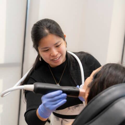 a woman staring at the camera with text that says Collagen like you're 20-something again. Ask about our new needle-free RF treatment