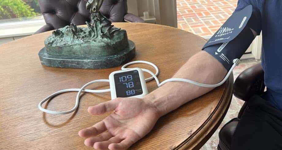 a person having their blood pressure taken with a blood pressure of 109 over 78.