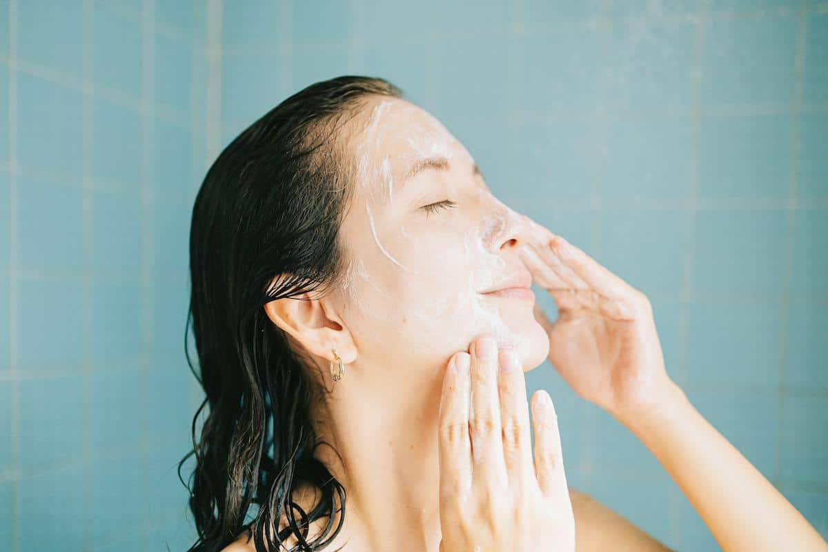 a lady washing her face