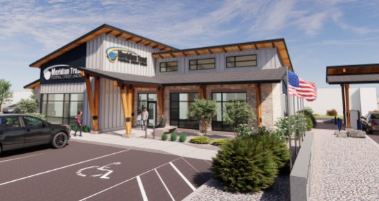 Meridian Trust Federal Credit Union branch exterior with parking and American flag.