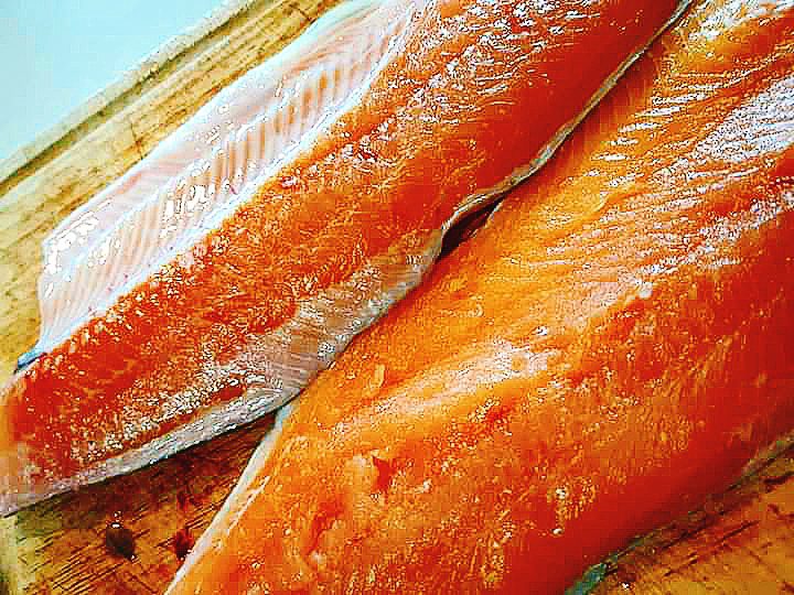 2 trout fillets on a chopping board