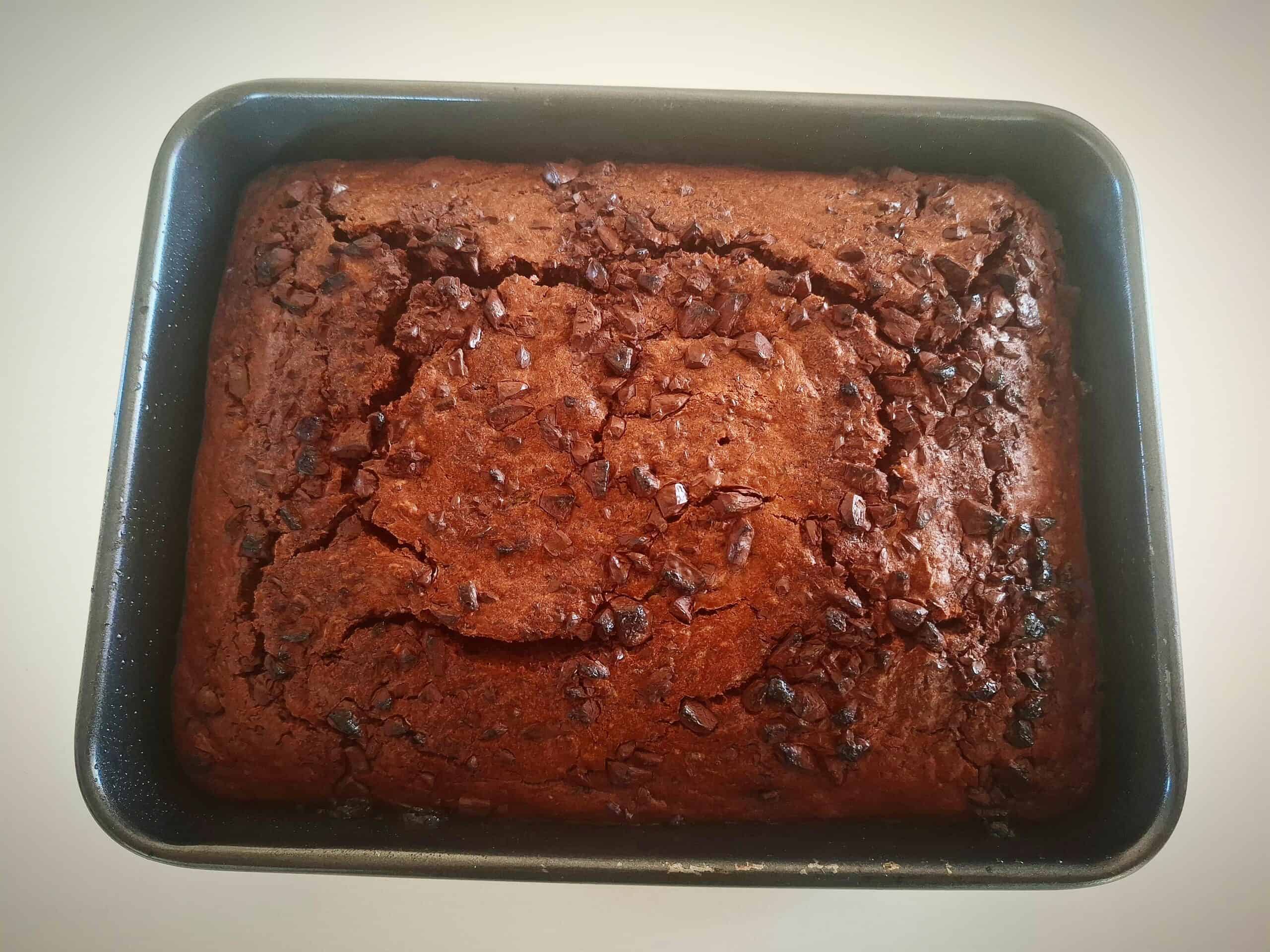 Baked chocolate and courgette cake in a rectangular cake pan.