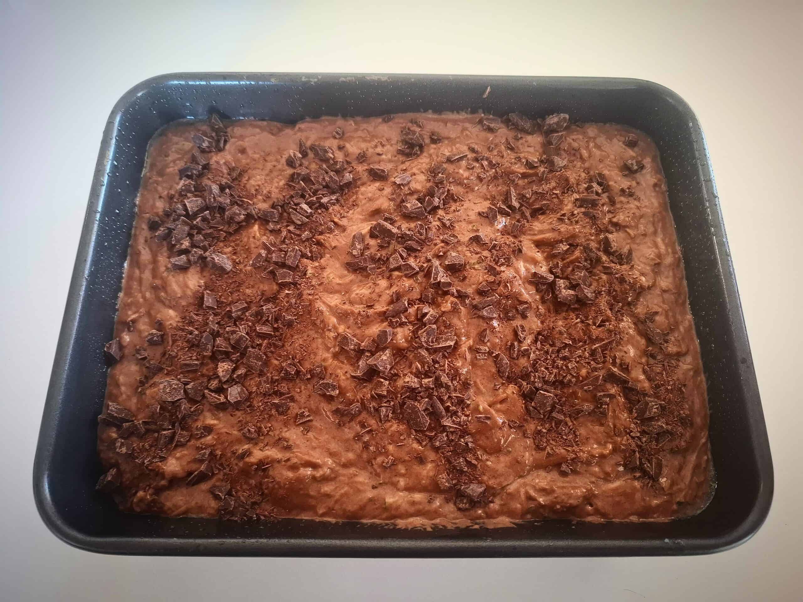 Chocolate chips sprinkled on top of chocolate cake
