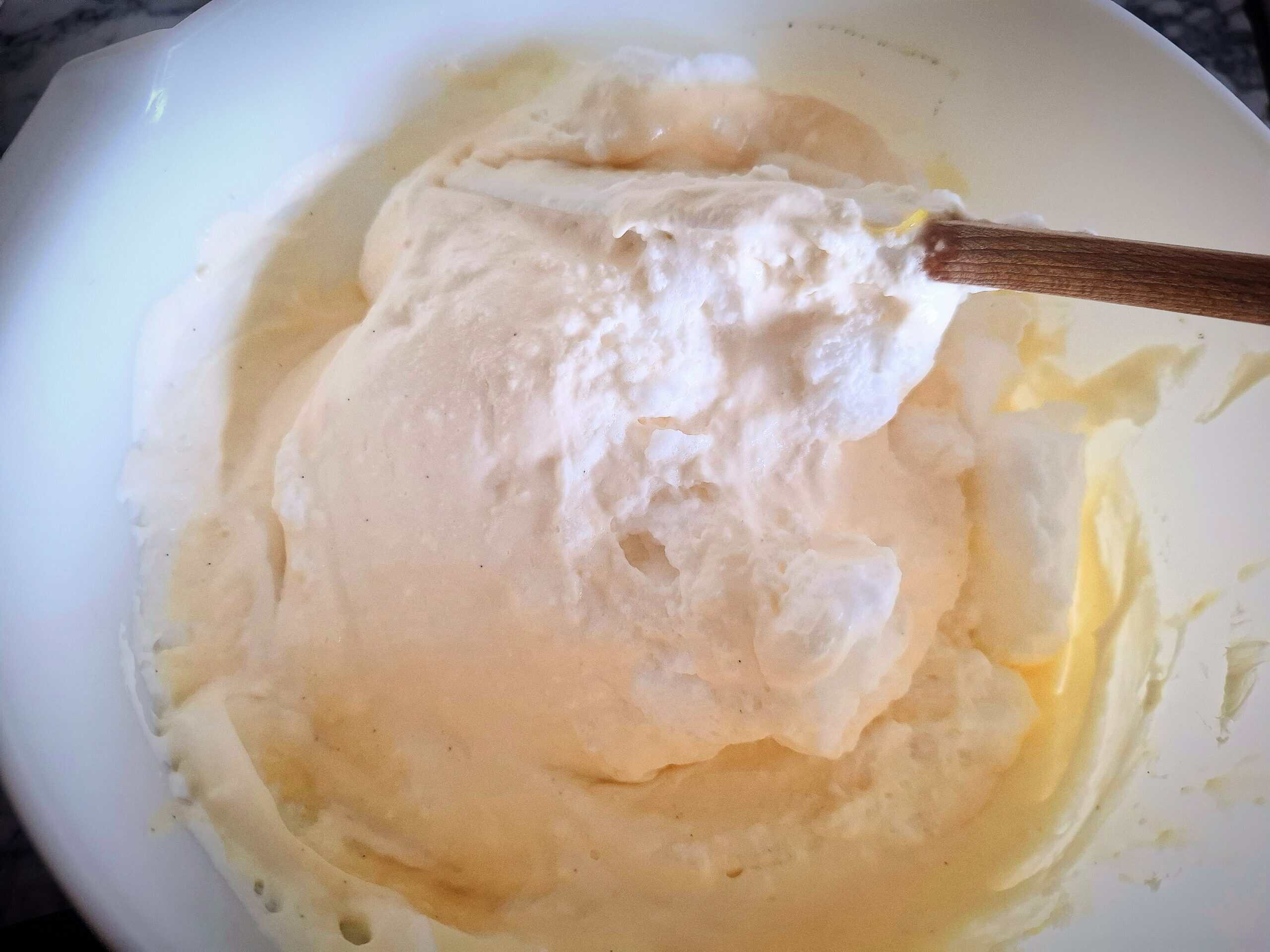 Egg whites being folded through the cheese cake mixture.