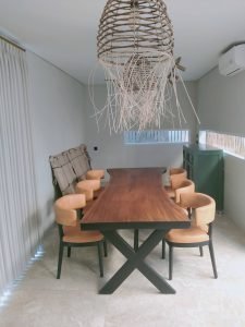 A collection of custom indoor teak furniture, including wardrobes, kitchen sets, and desks, manufactured by Naramulya for the Ketewel project.