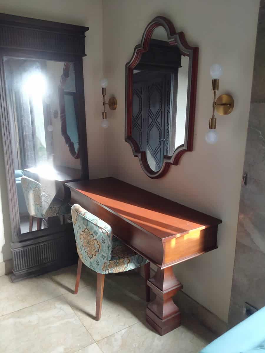 A collection of custom indoor teak furniture, including wardrobes, kitchen sets, and desks, manufactured by Naramulya for the Ketewel project.