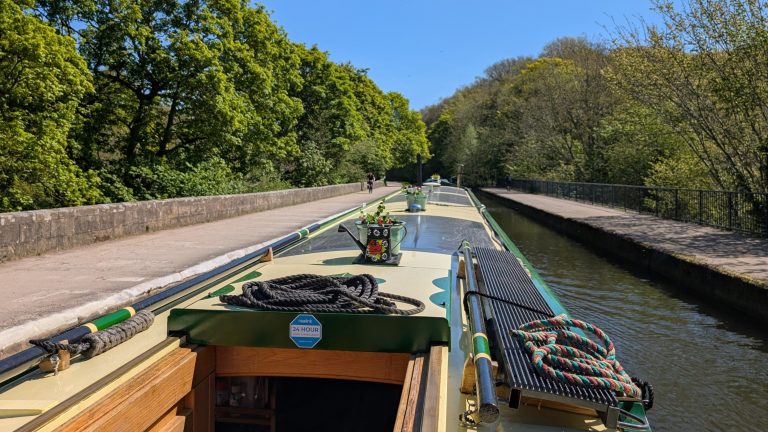 A Narrowboat Cossing an Aqueduct