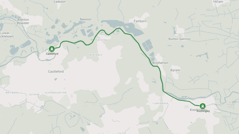 Scenic canal route in the UK with narrowboat cruising through countryside.