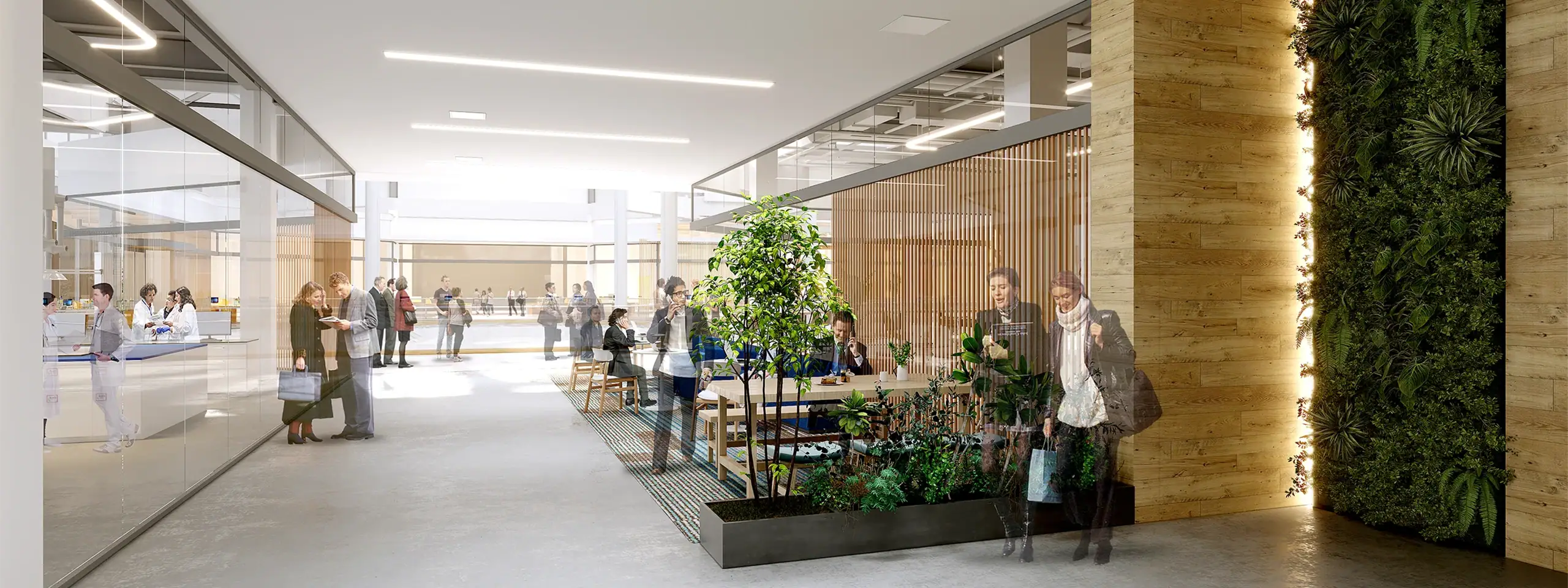 Modern lobby with natural light, greenery, and people waiting or walking.