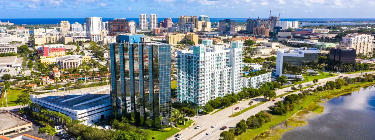 Aerial view of modern high-rise buildings along a river in downtown Jacksonville, Florida.