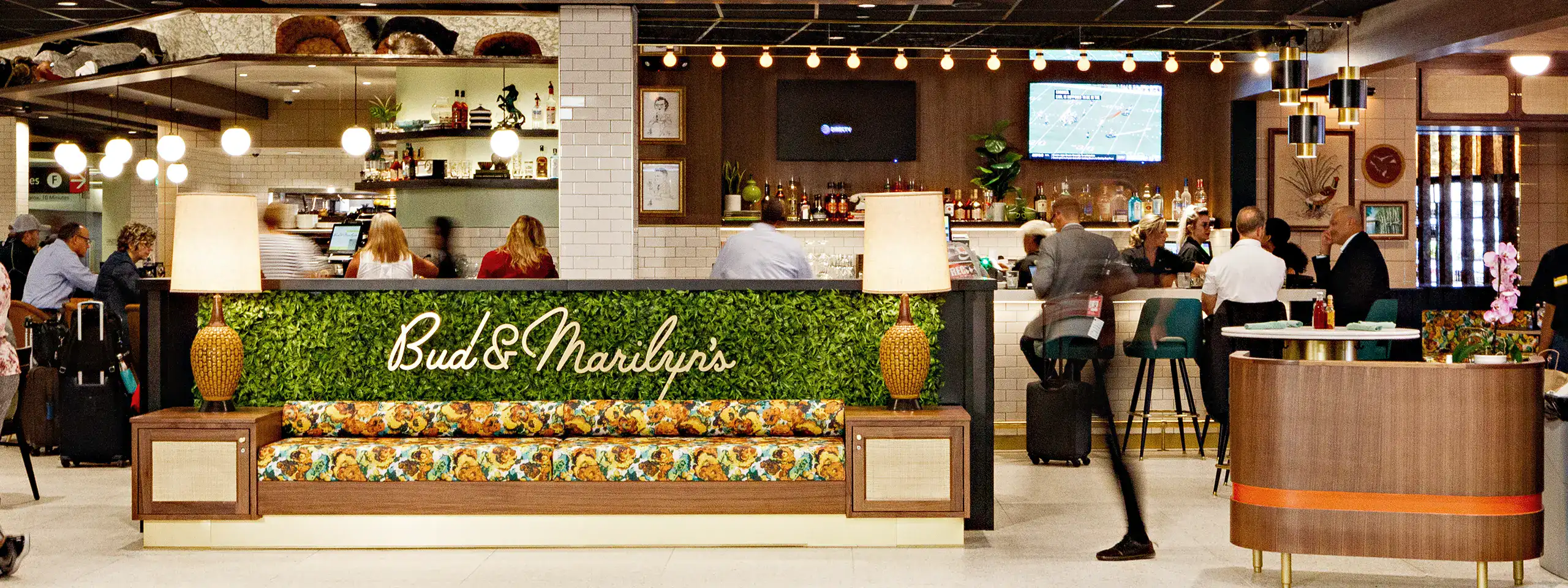 Interior of Bud & Marilyn's restaurant with patrons and bar area.