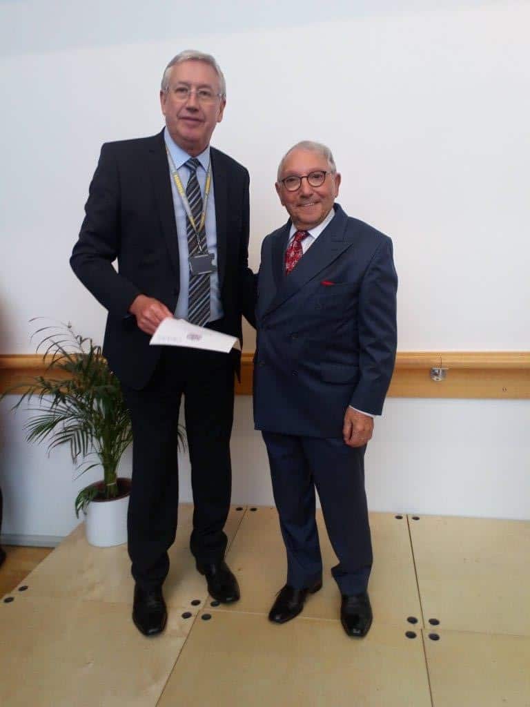 John Ainley receiving his certificate from the Youth Zone’s president, Sir Norman Stoller
