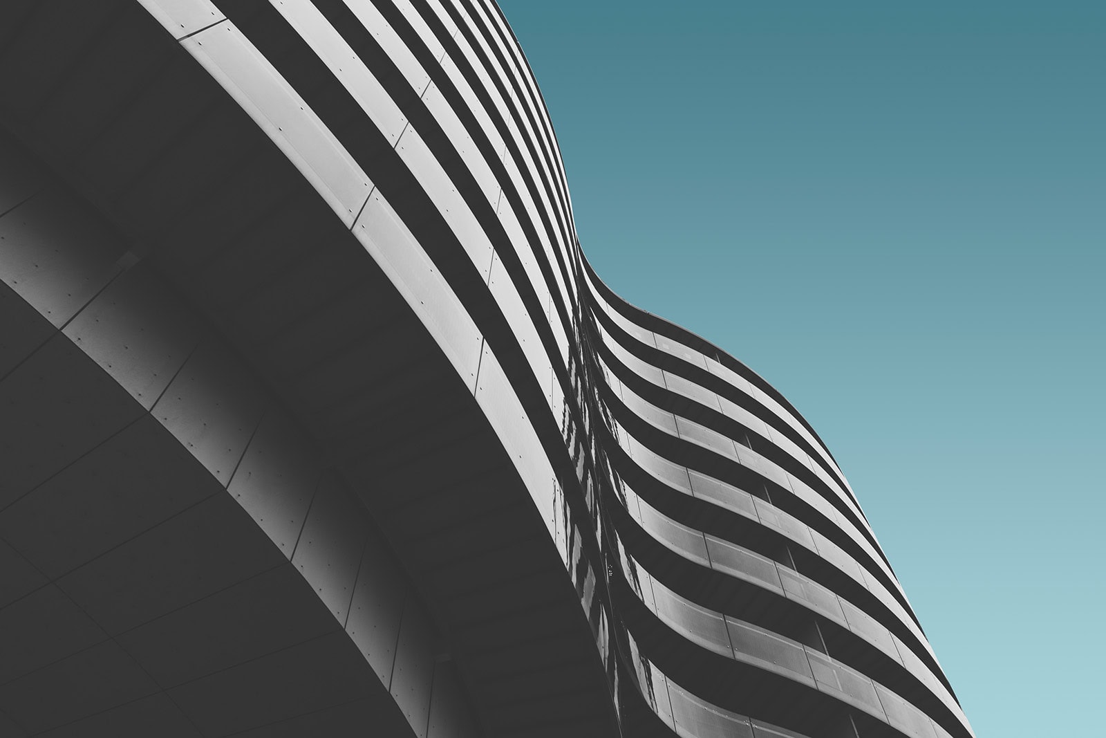Modern building with curved architecture for offering memorandum presentation.