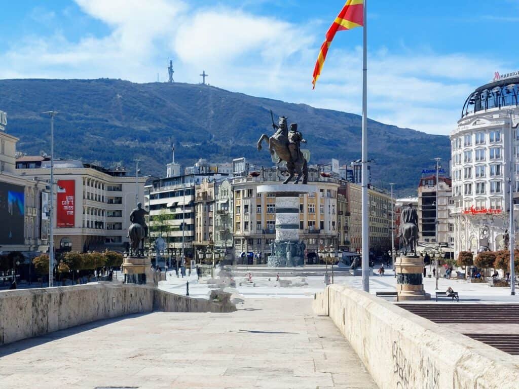 Macedonia Square,with the warrior statue in Skopje, with Mount Vodno and the Millennium Cross in the background