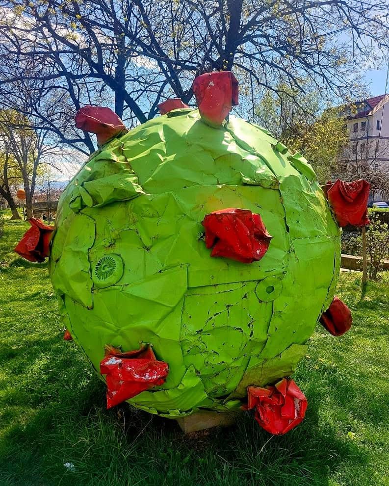 green and red sculpture possibly of a covid virus in Tetovo
