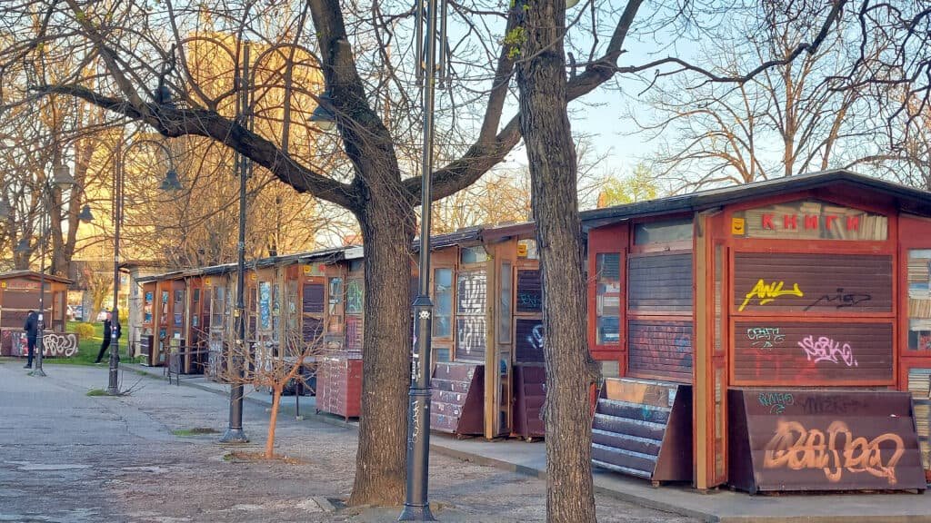 skopje riverfront book sellers in wooden cabins on the river vardar banks close to cafes and the famous wooden galleons of Skopje