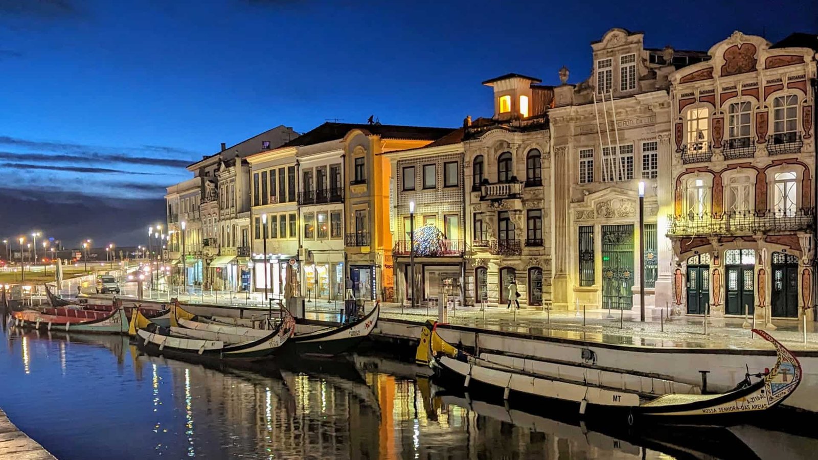 Aviero canalside Moliceiros lined up at night