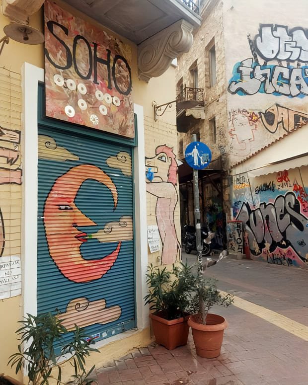 street scene in Exarchia Athens, Greece - grafitti and coloured streets including an orange crescent moon
