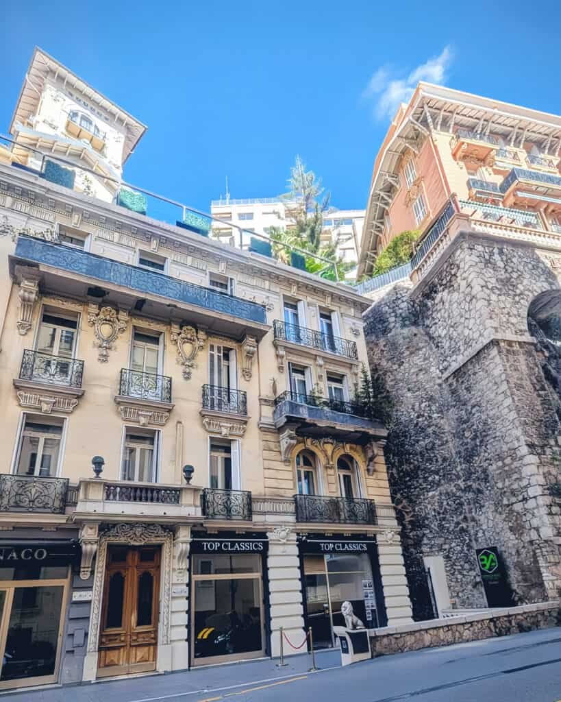 passing classic car show room up hill in monaco