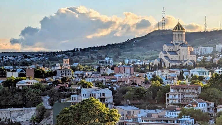 Sunrise over Tbilisi from Narikala Hill - Holy Trinity Cathedral of Tbilisi (Sameba) in prominent view